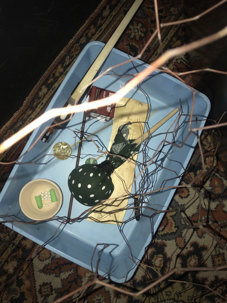 a box with the playing tools messily inside