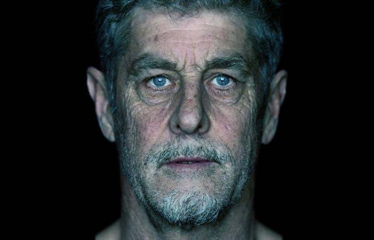 A very direct portrait of Ant. He is looking staright down the lens. The photo is very clear and shows every wrinkle and pore.